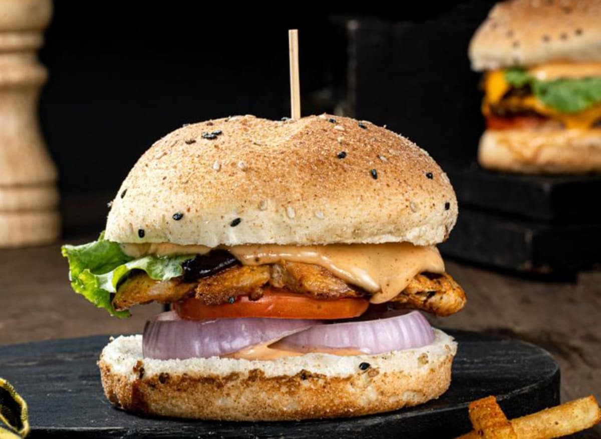 A flawlessly grilled juicy chicken topped with burger sauce, onions, tomato etc.