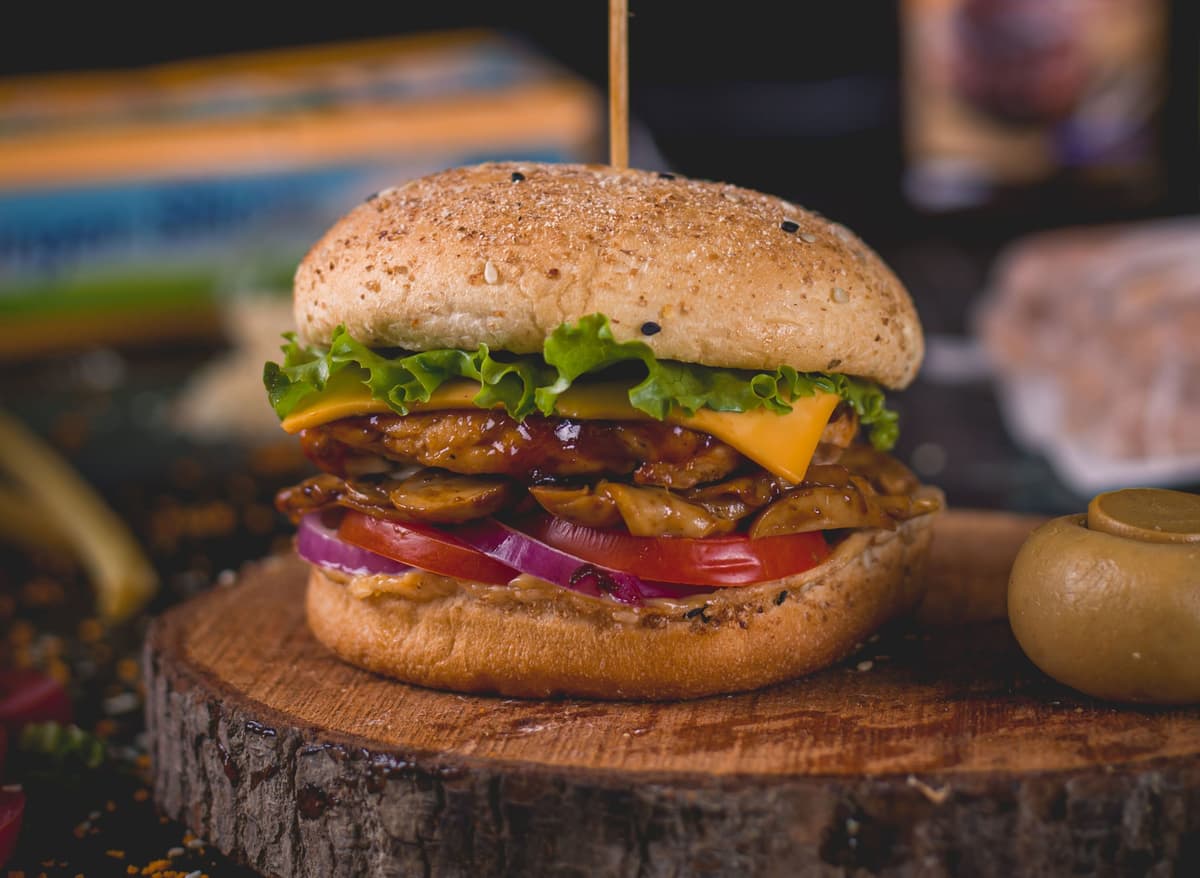 Burger filled with mushroom chicken, onion, cheese, tomato etc.