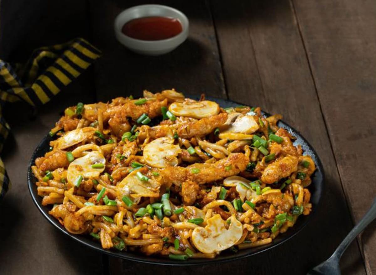 Chicken, mushroom, colorful vegetables, fried noodles tossed in savory sauce.