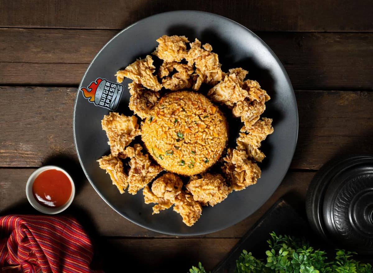 Crispy, juicy fried chicken served on a bed of tender rice.