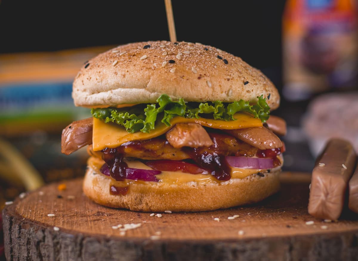 Chicken sausage patties are topped with cheese, onions sauce etc.